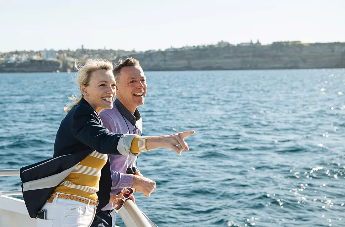 Couple spotting whales sightseeing hoho with Sydney Heads in the background wildlife non-ccc dnsw